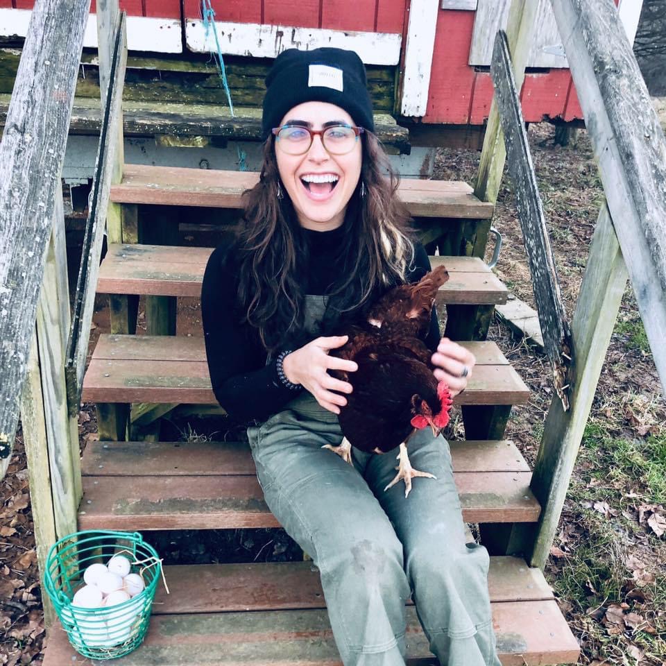 Shani Mink hanging out with a hen at the Pearlstone Retreat Center in Reisterstown, Maryland
